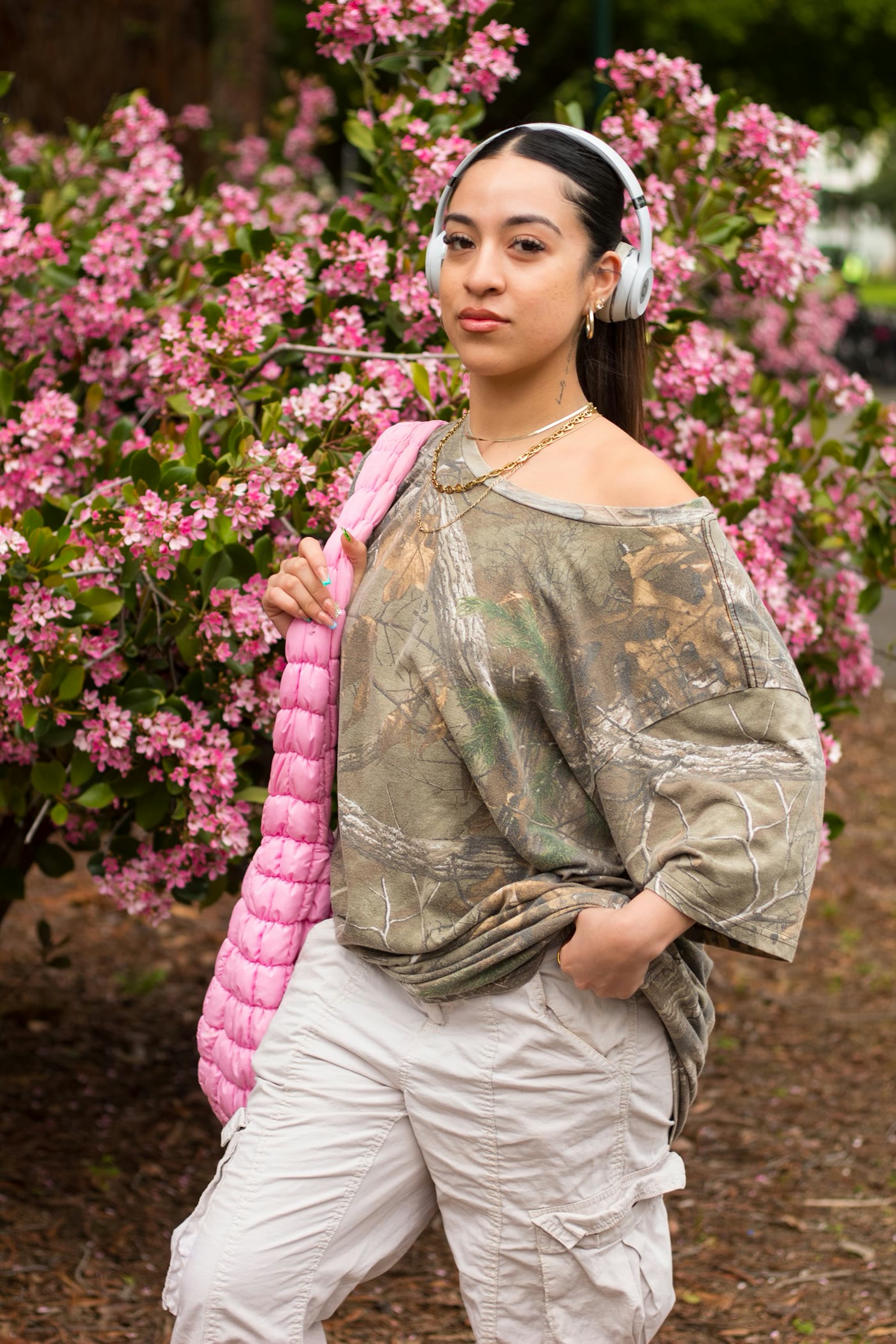 Portrait beside pink flowering branches