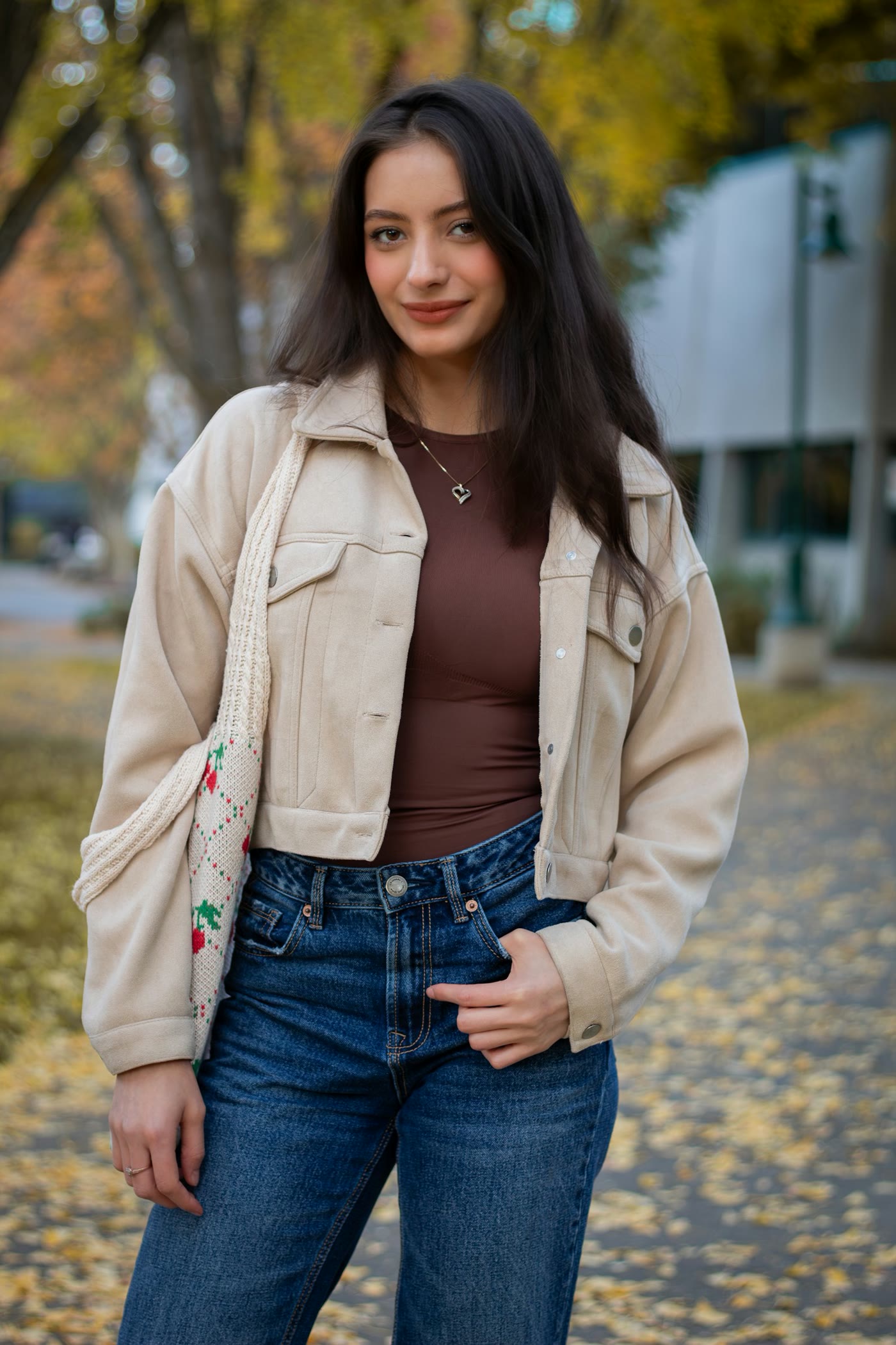 Woman in a cream jacket on an autumn path