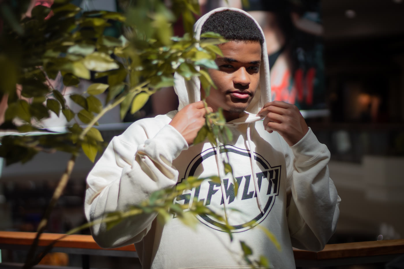 Portrait of Mo wearing a hoodie