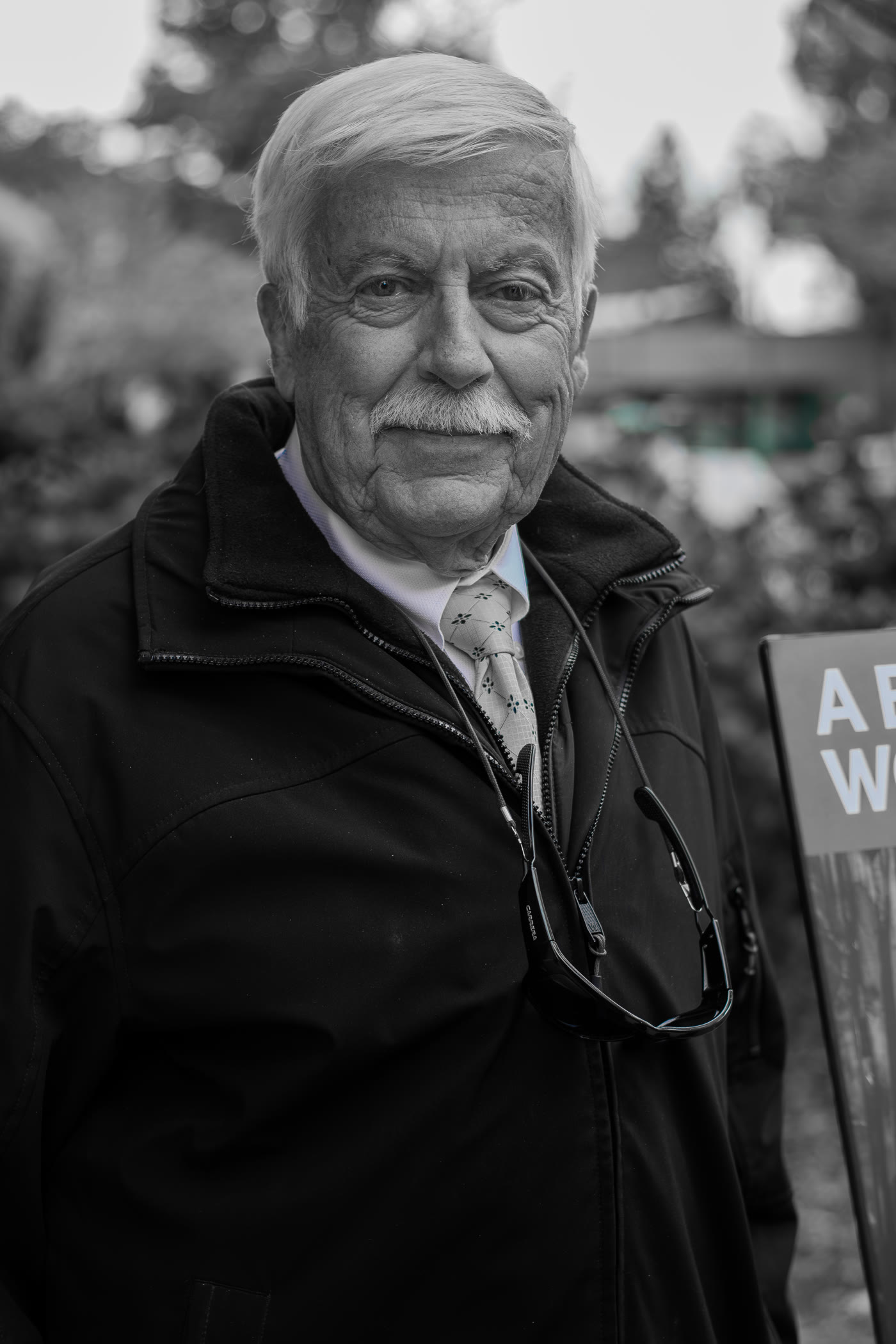 Black-and-white portrait of an older man looking away